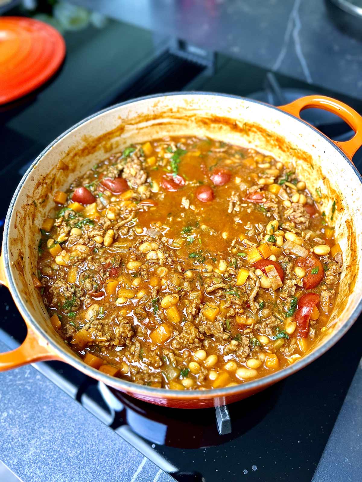 Baked beans with mince beef, reduced and cooked to perfection in a pot, ready to be served.