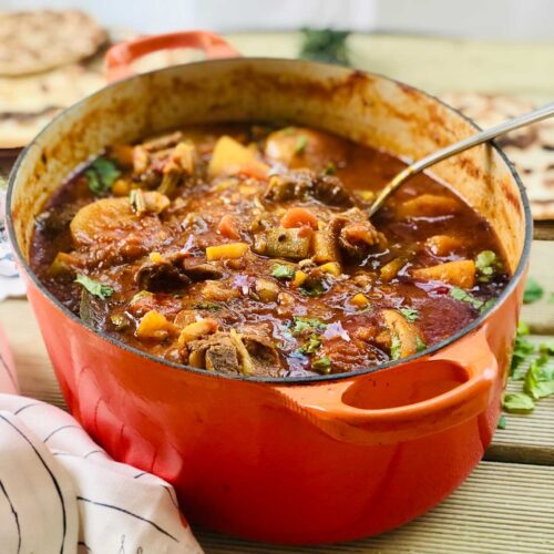 Beef casserole in an oval orange cast iron dish