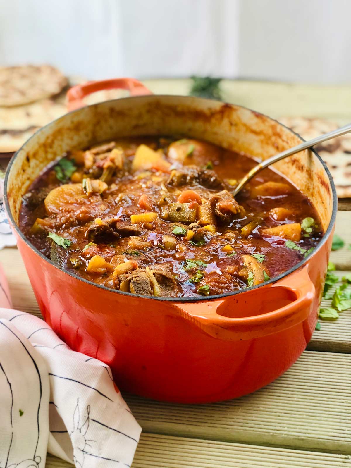 Beef casserole in an oval orange cast iron dish