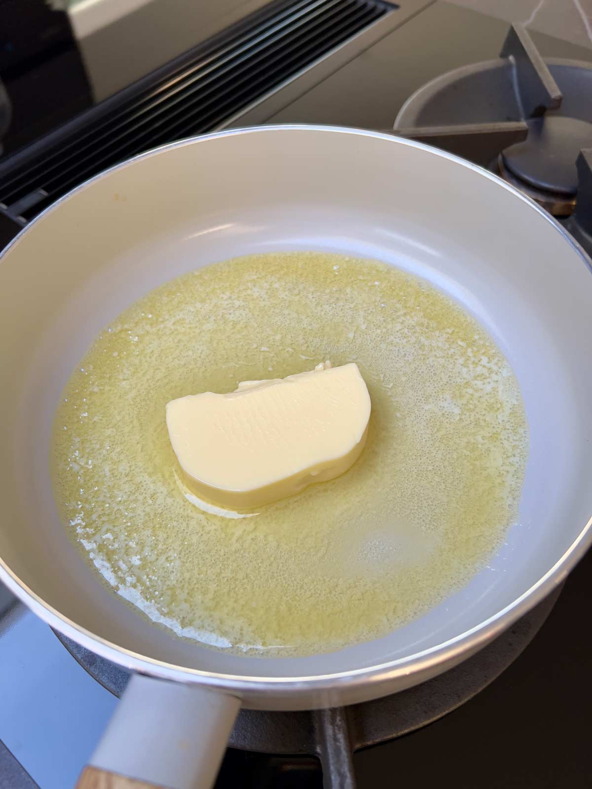 Butter melting in a pan.