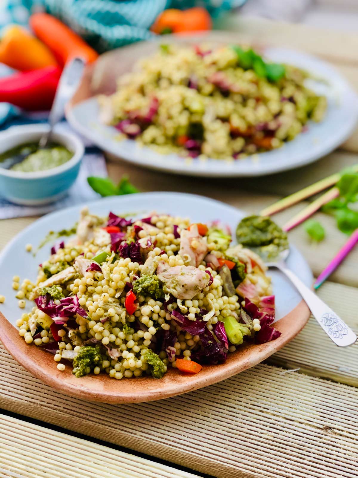 Healthy Chicken breast recipe with giant couscous, pesto sauce and radicchio