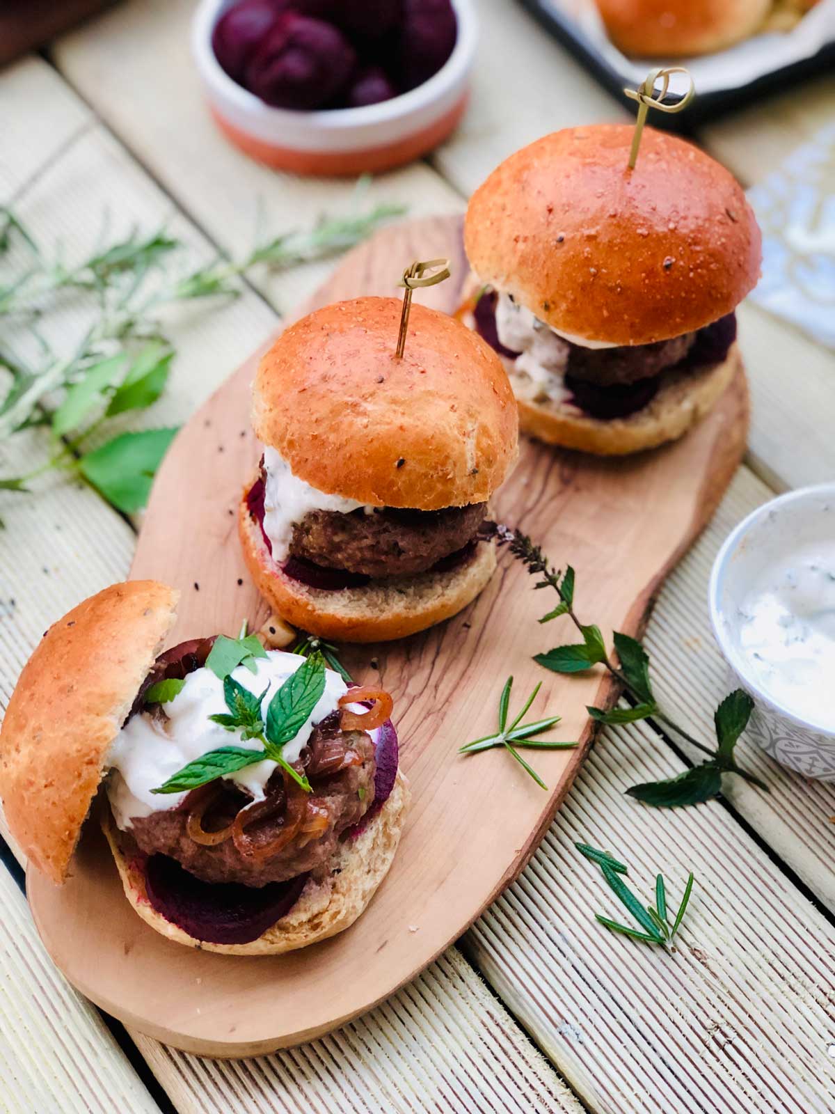 Homemade burgers with mint and cumin yogurt sauce