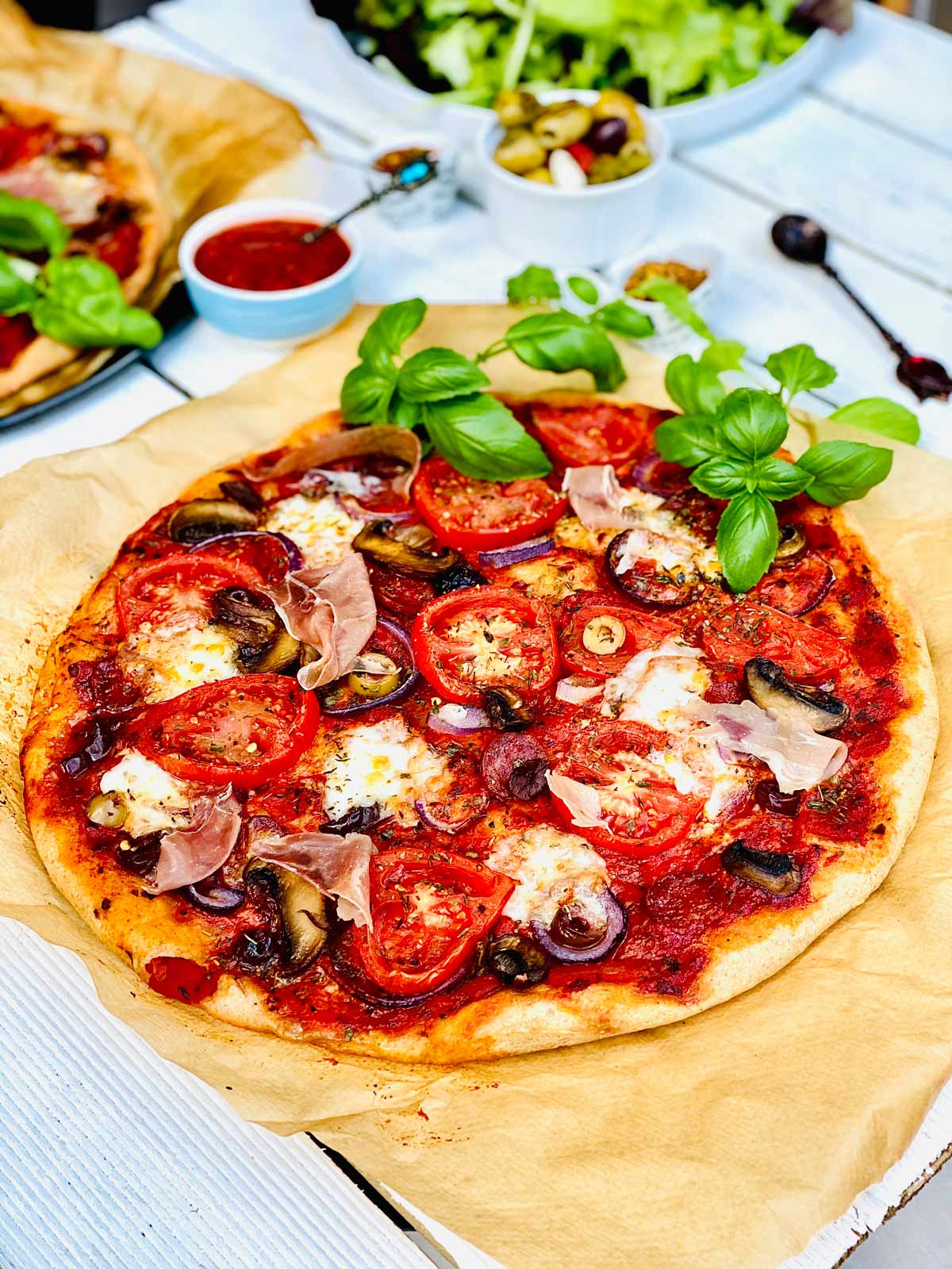 Healthy homemade pizza on brown parchment paper