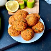 Vegan Lentil meatballs on a little white plate.