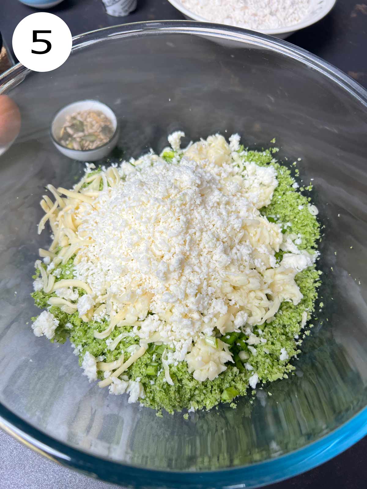 Mozzarella cheese and hard cheese added to the broccoli.