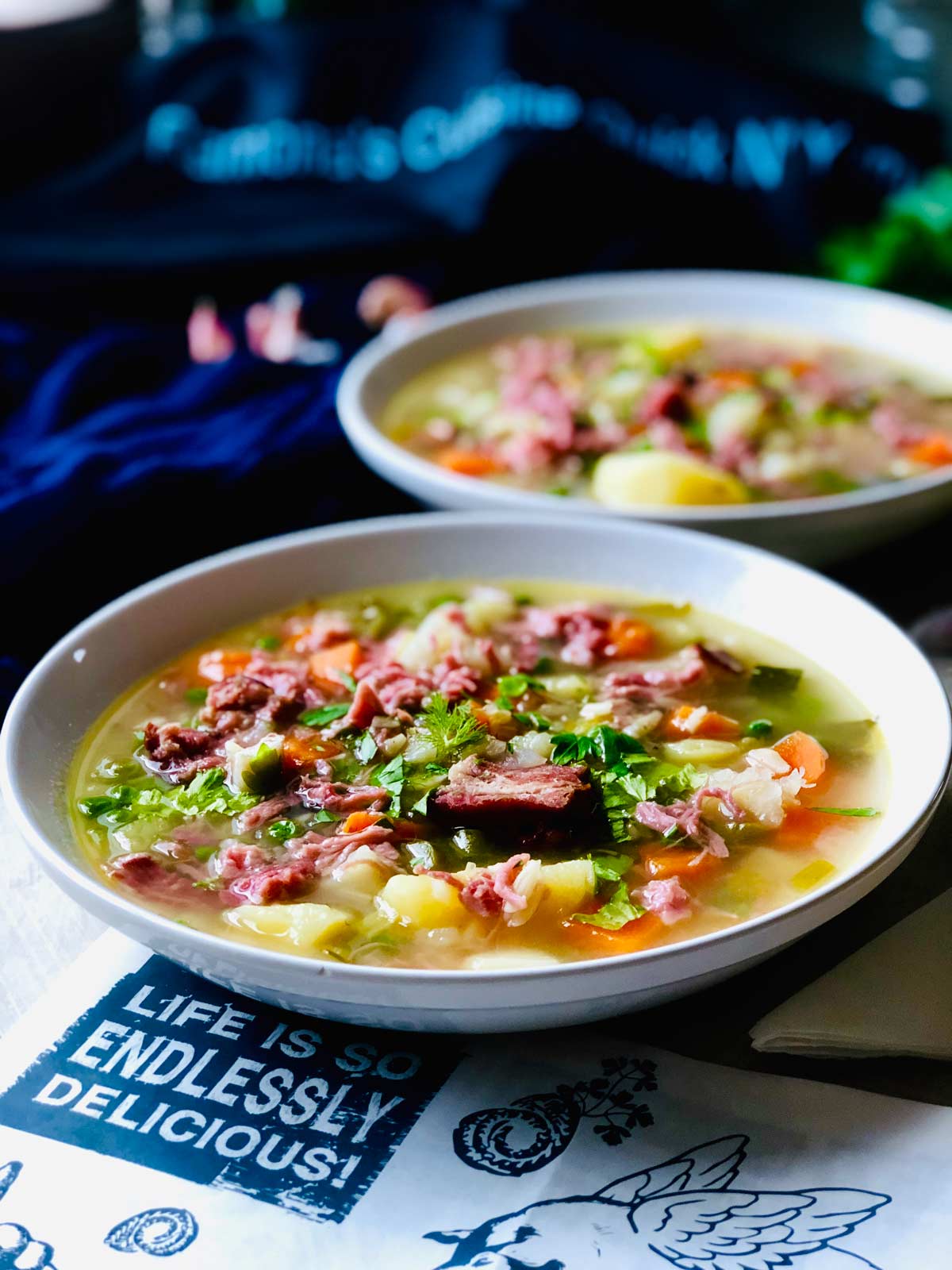Potato soup with ham hock and petit pois (garden peas)