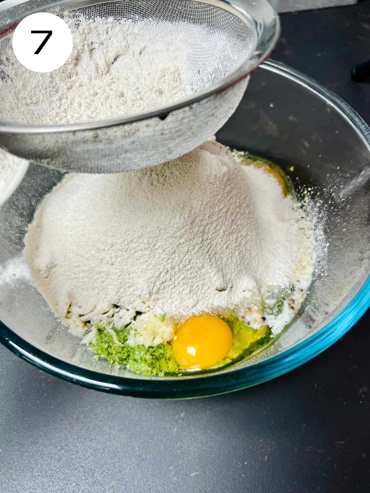 Sieving the flour to the high-protein broccoli bread.