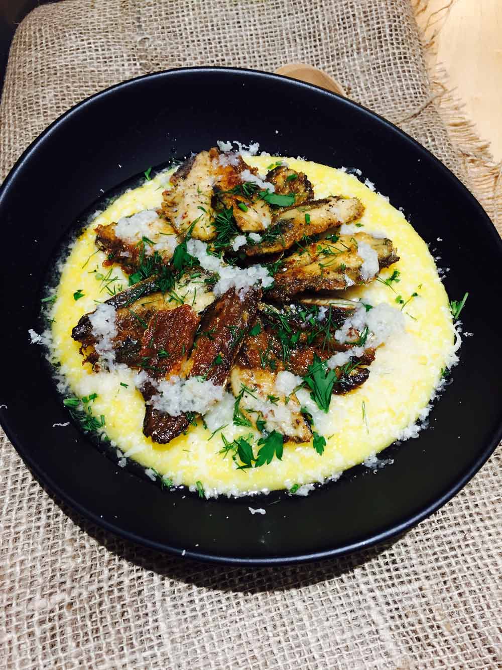 sardine and polenta with garlic and Parmesan cheese