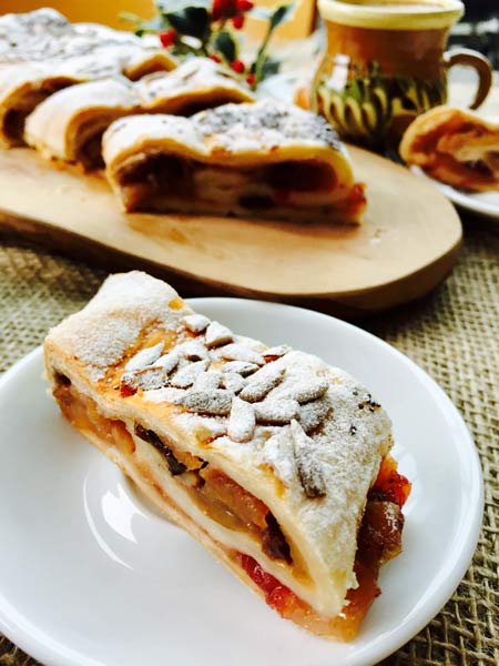 A close-up of an apple strudel roulade.