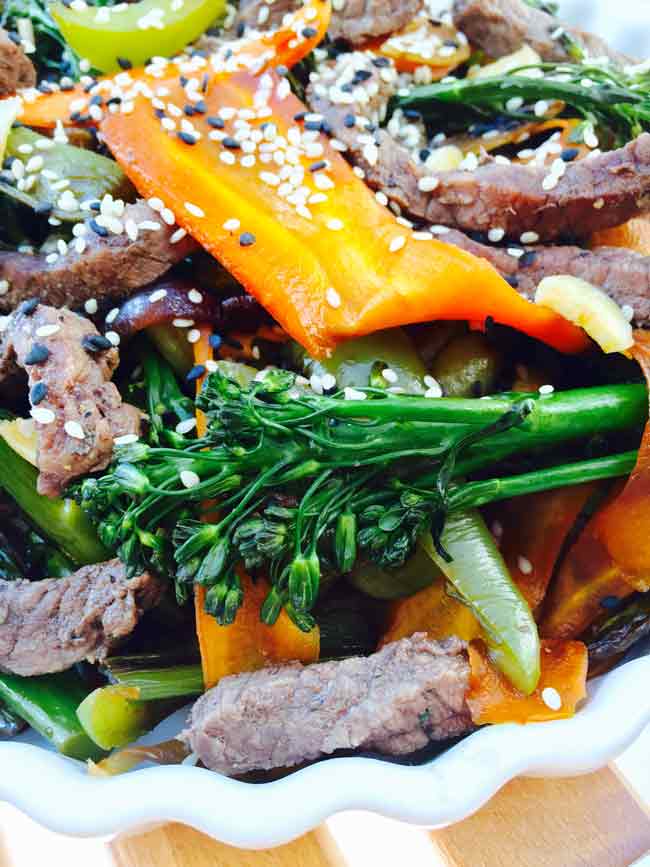 Close up beef hoisin stir fry with tenderstem broccoli