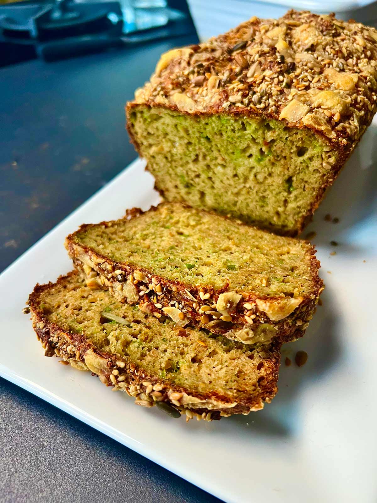 Broccoli and cheese bread with mixed seeds, sliced and ready to be served.