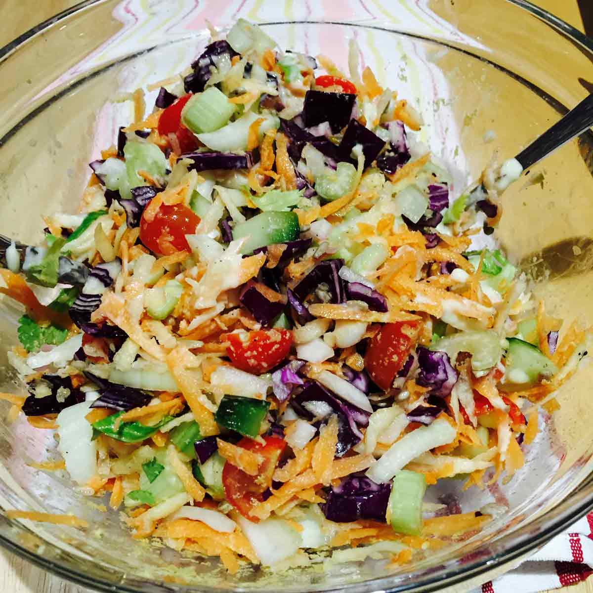 Carrots and red cabbage salad, in a transparent bowl