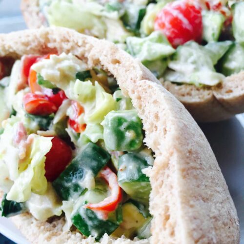 Chicken and beef pastrami salad in pitta breads