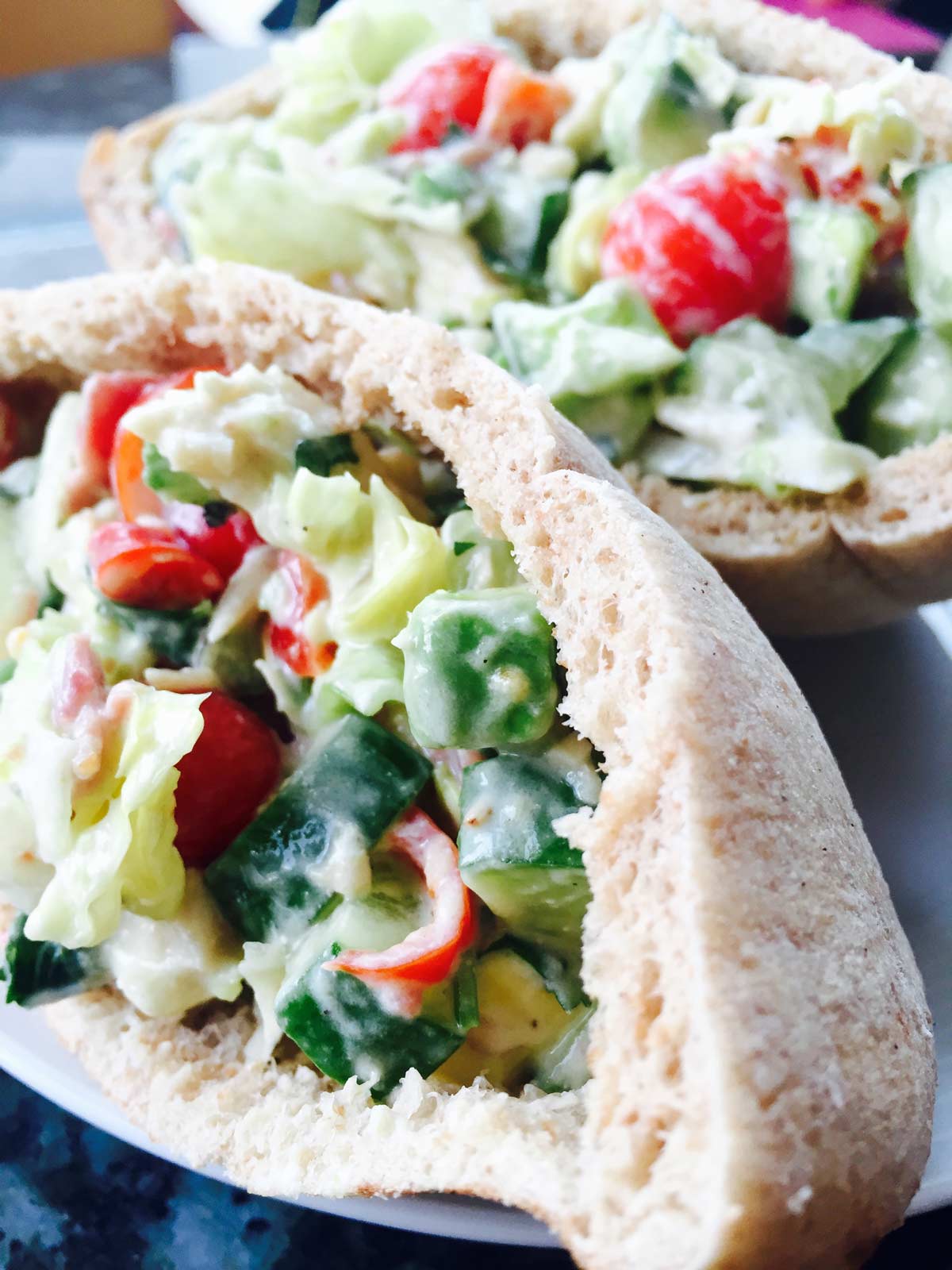 Chicken and beef pastrami salad in pitta breads