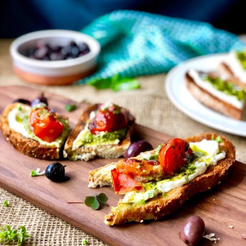 Cream cheese and pesto toast and basil flowers