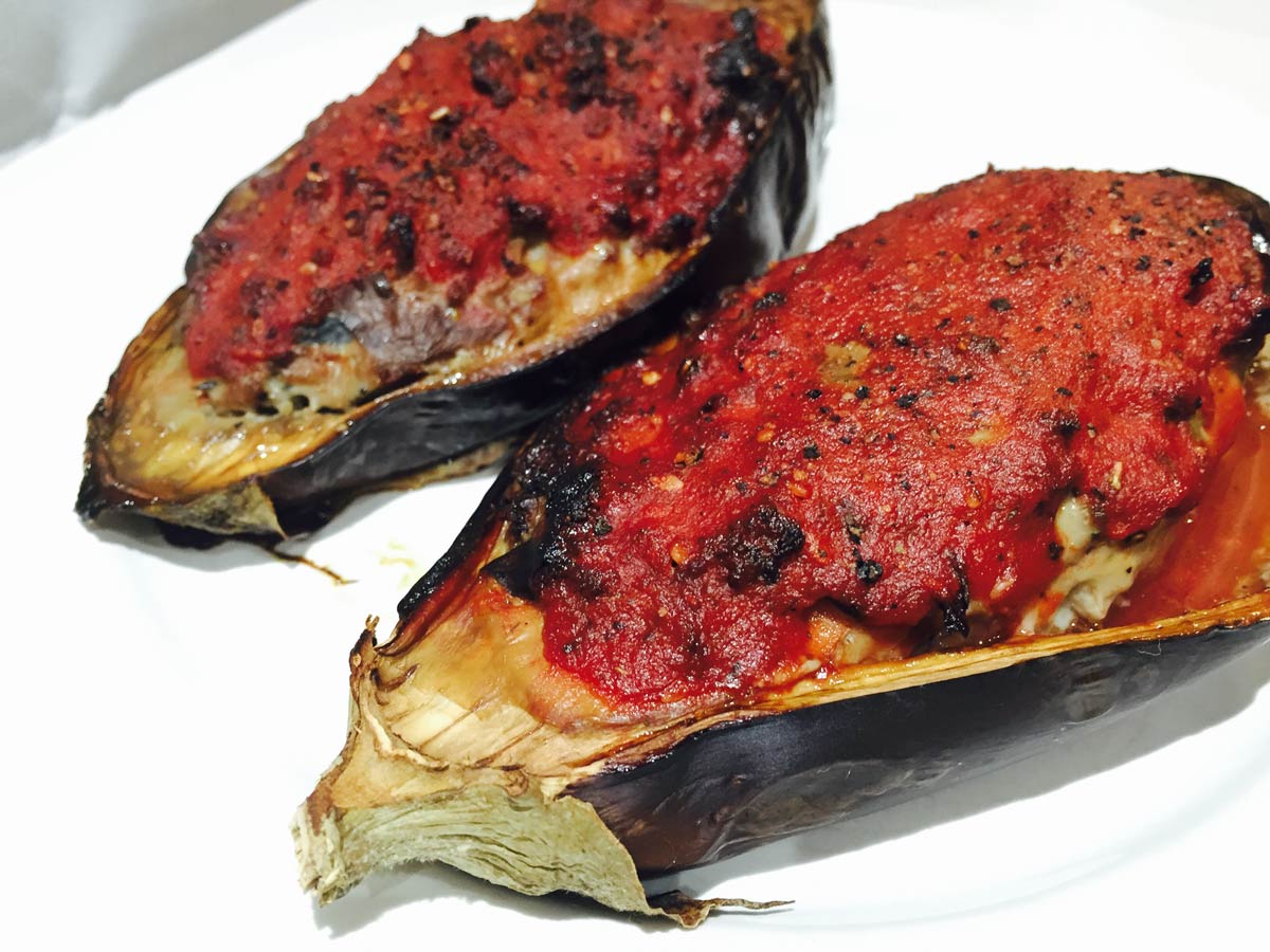 Crisp stuffed aubergines, on a plate