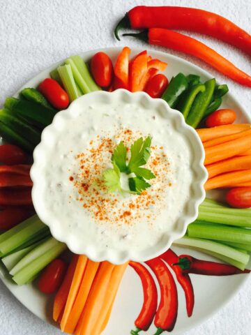 Cucumber, fennel and yoghurt dip, in a white bowl