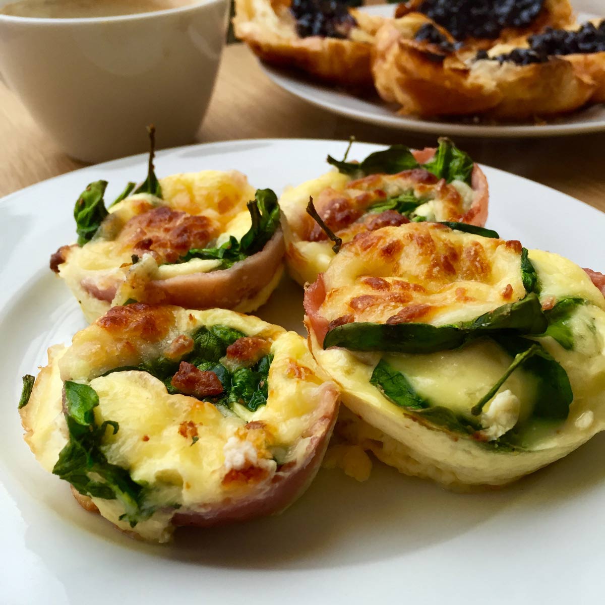 Four cupcake omelette on a white plate