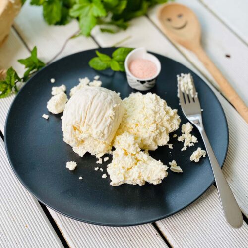 Farmer's cheese on a black plate