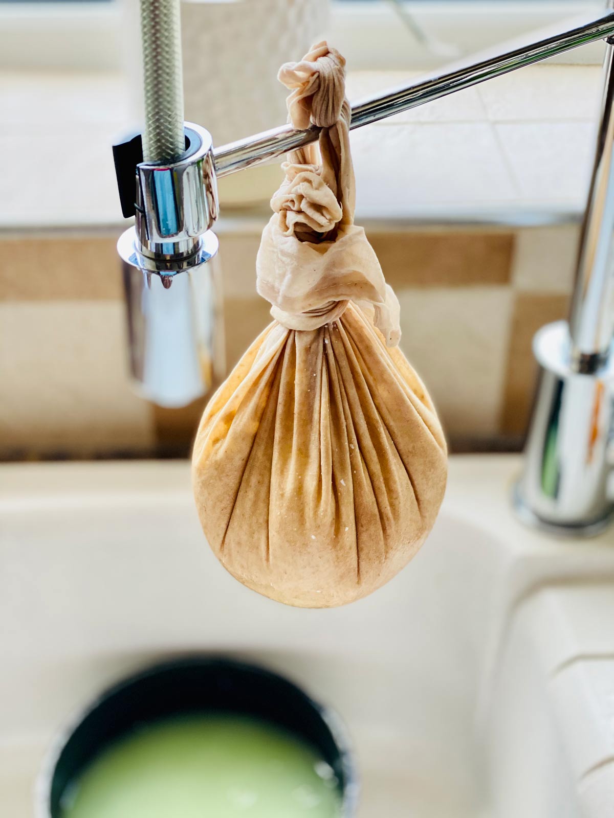 Farmer's cheese in a cloth draining