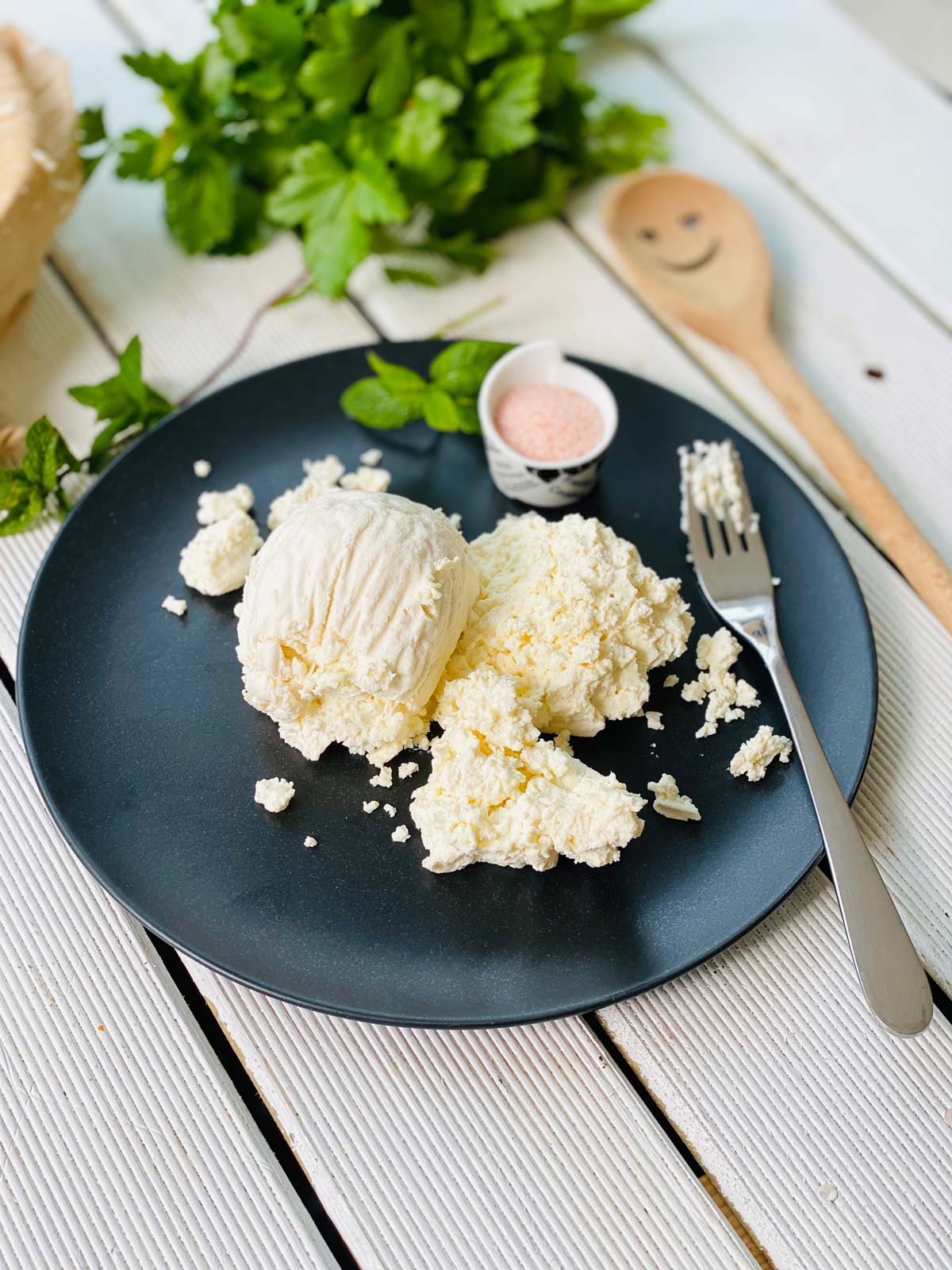 Farmer's cheese on a black plate