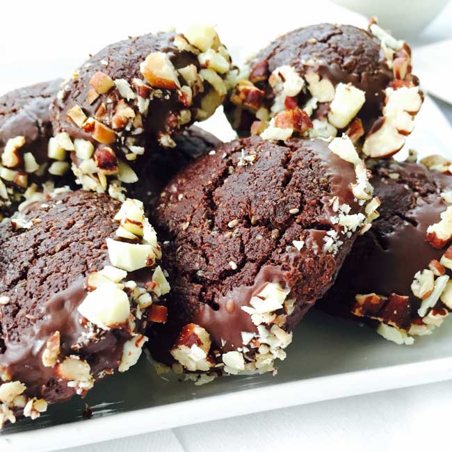 A close-up of flaxseed, cacao & pecan nuts cookies