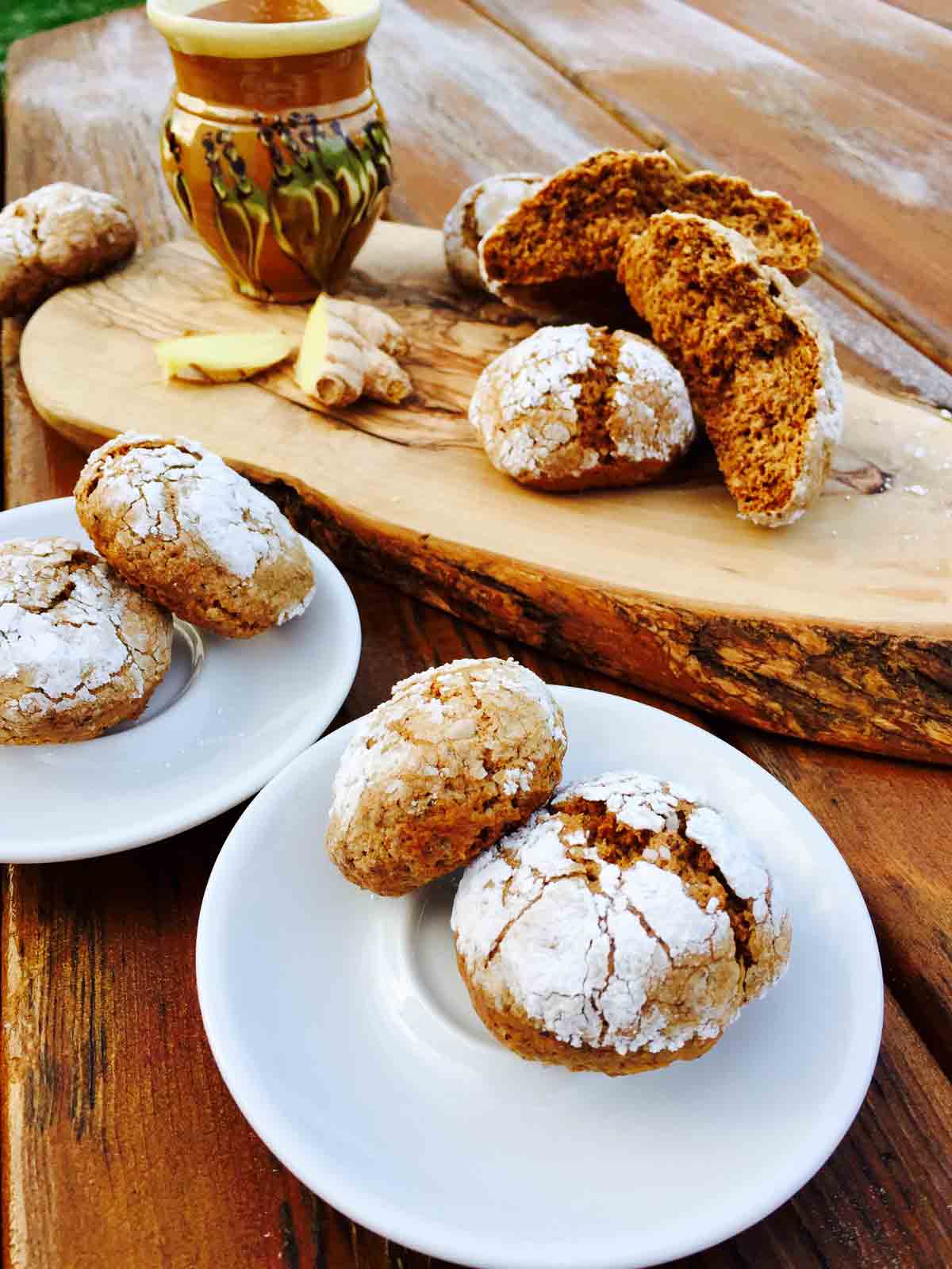 Two white plates with tasty turmeric and ginger cookies, all gluten-free.