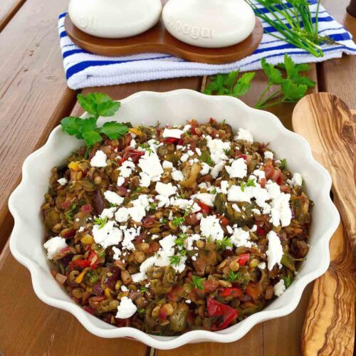 Green lentil & feta cheese salad in a white bowl