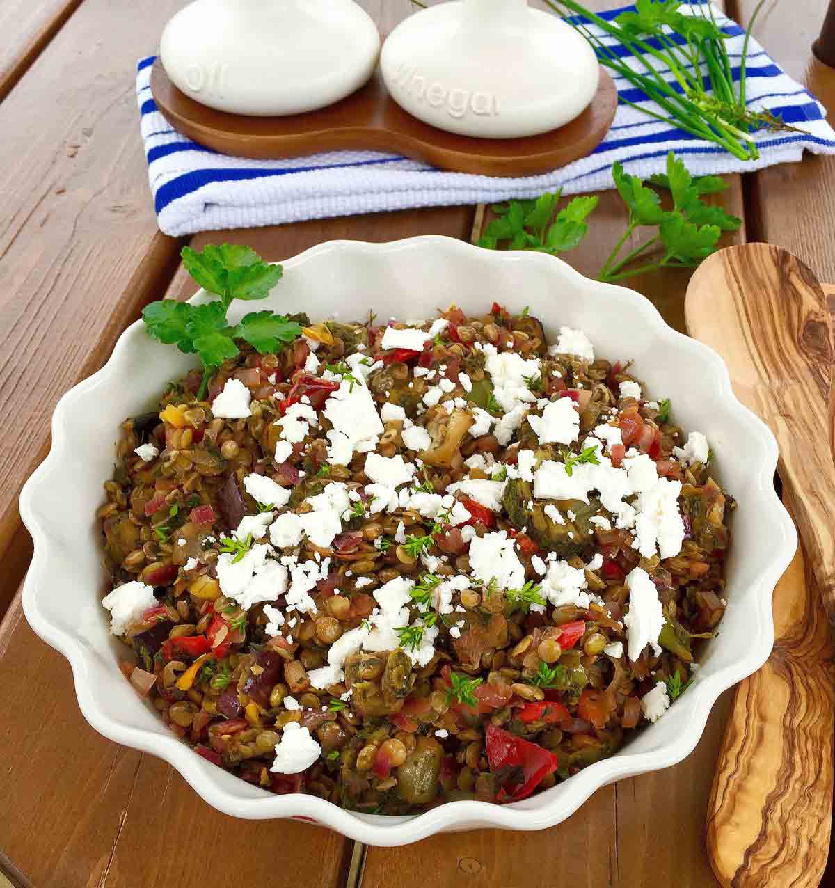 Green lentil & feta cheese salad in a white bowl