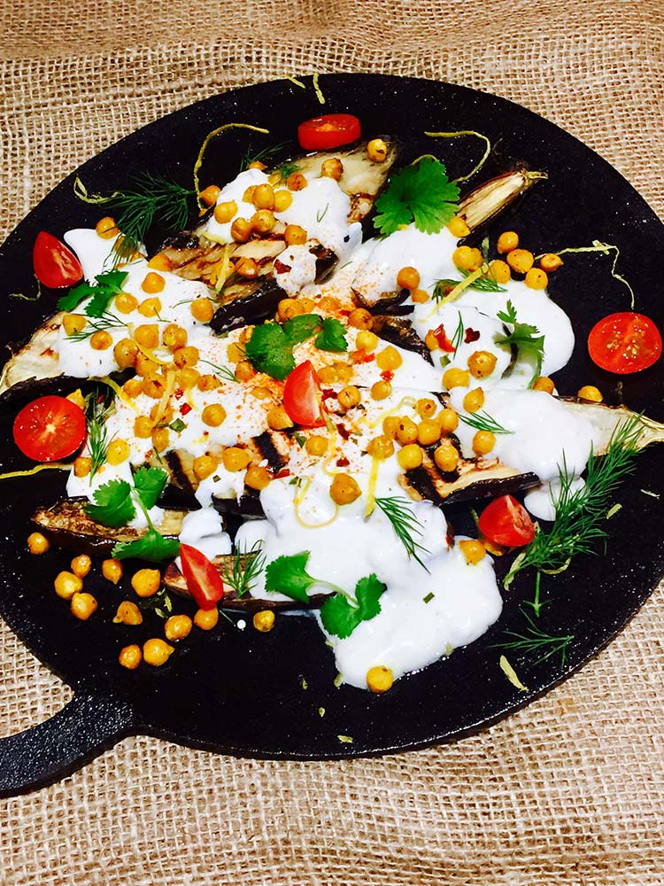 Baked aubergine with cumin and yoghurt sauce pan