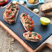 Kidney and pinto bean hummus on a black boardf