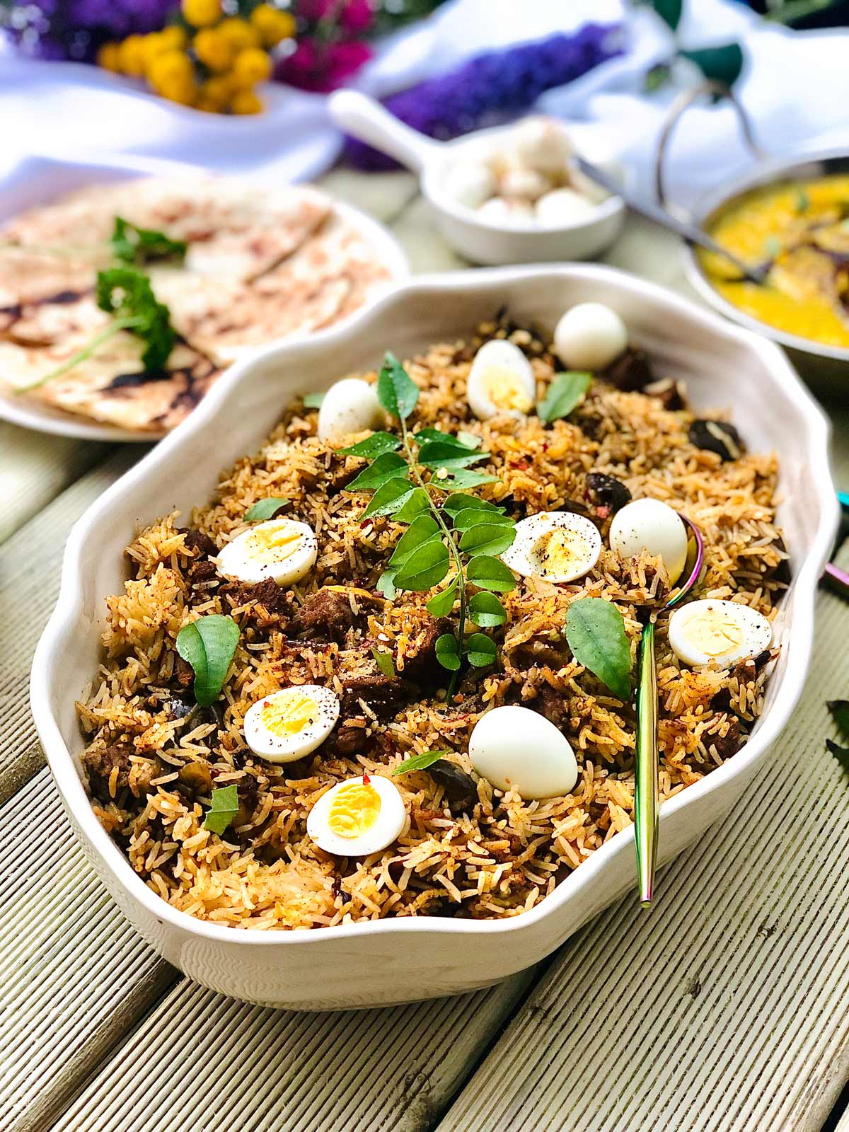 Superb Lamb Biryani with Quail Eggs in a White Dish