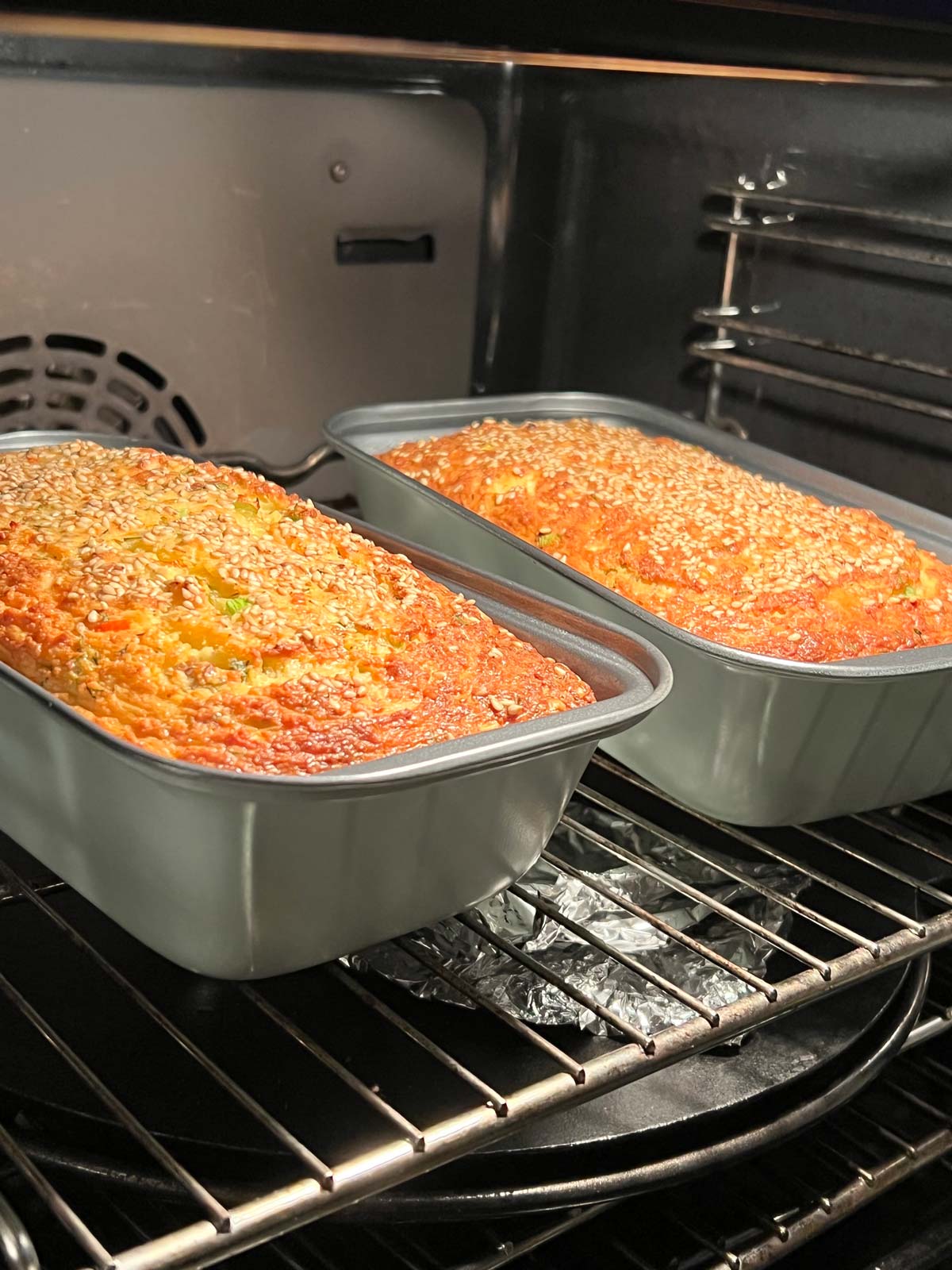 Two tins of lentil bread in the oven