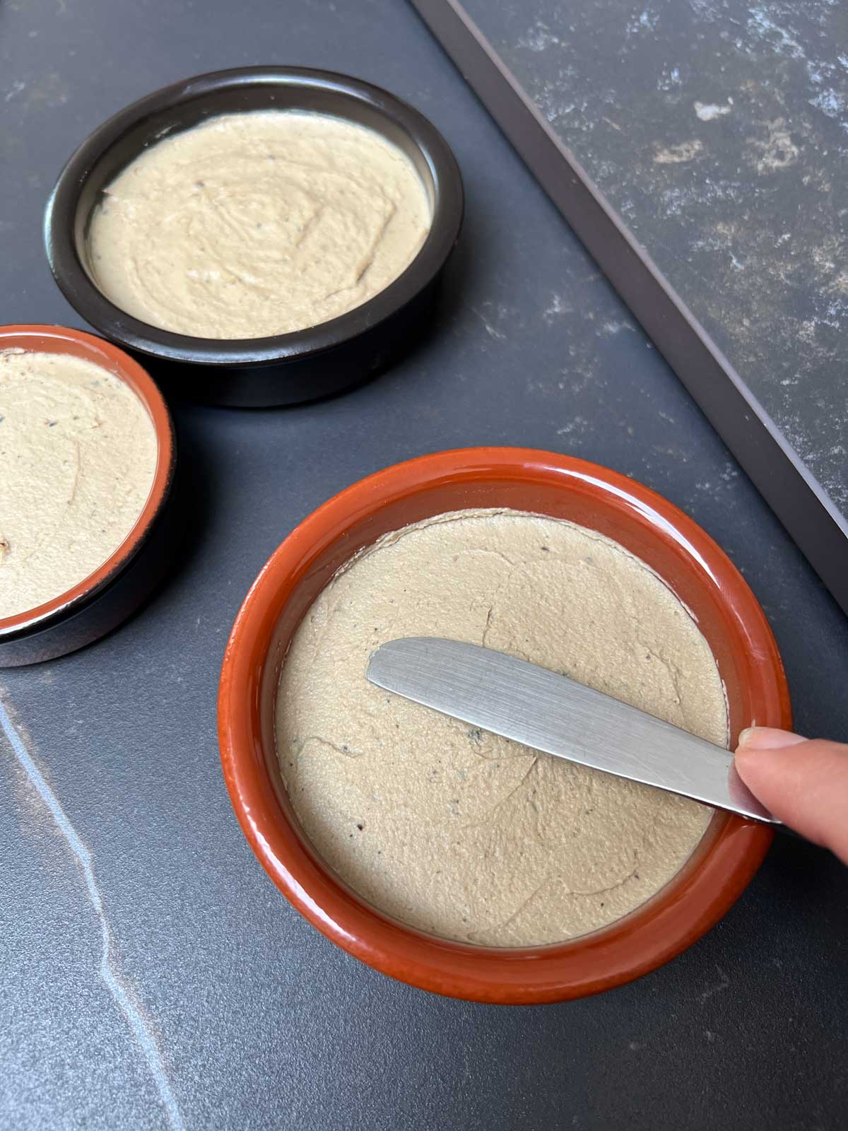 Liver parfait in ceramic ramekins.