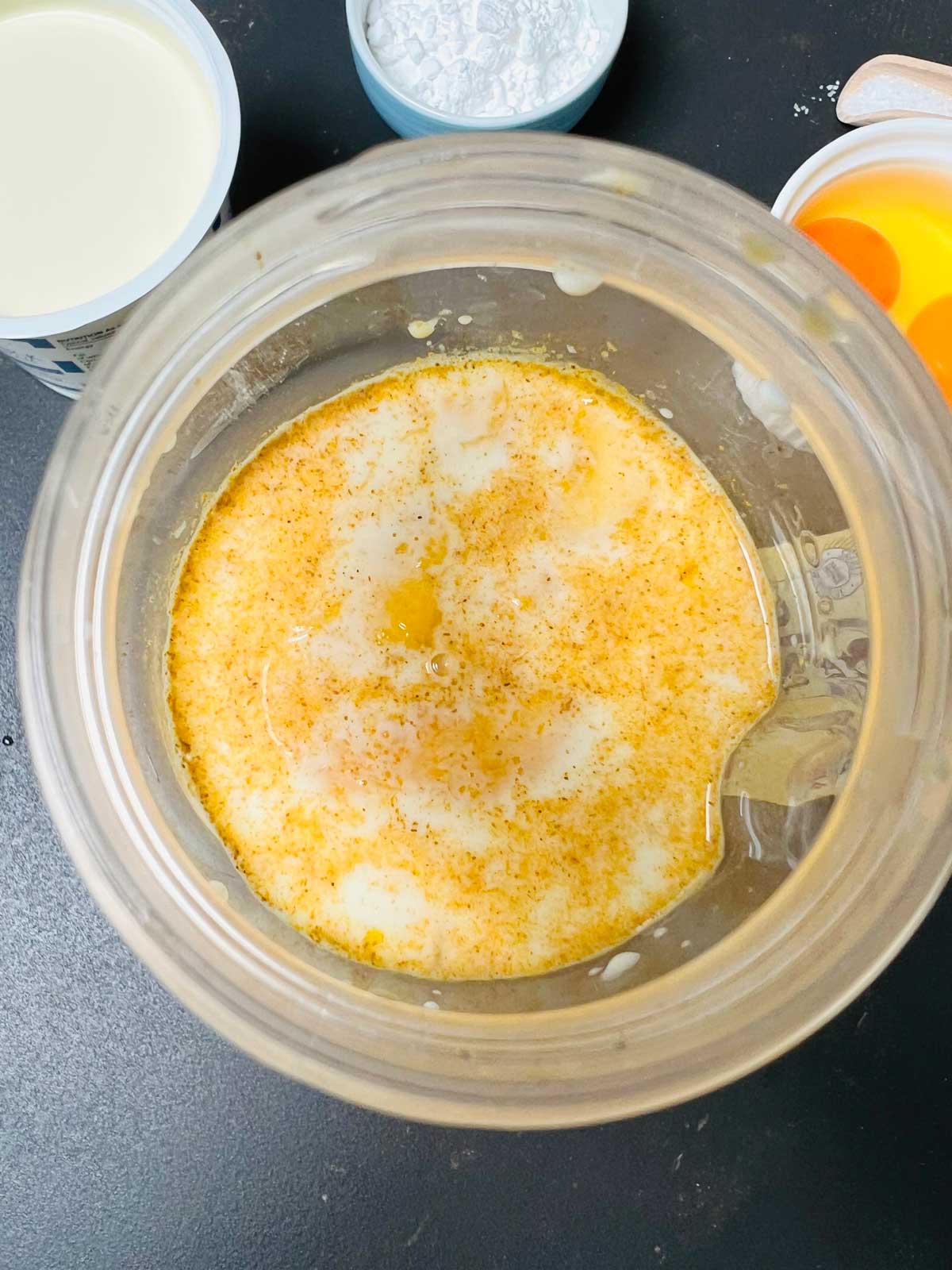 Mango pancakes ingredients mixed in a blender.
