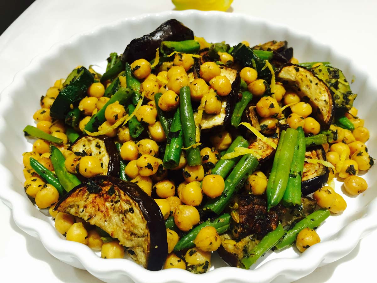 Nettle and chickpeas salad, in a white bowl