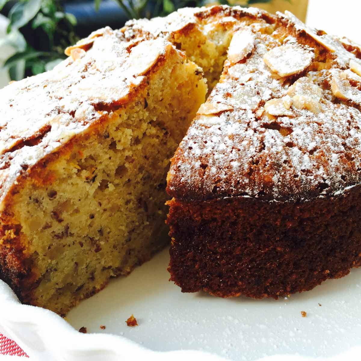 A slice of nuts ricotta cheese cake, in a white bowl