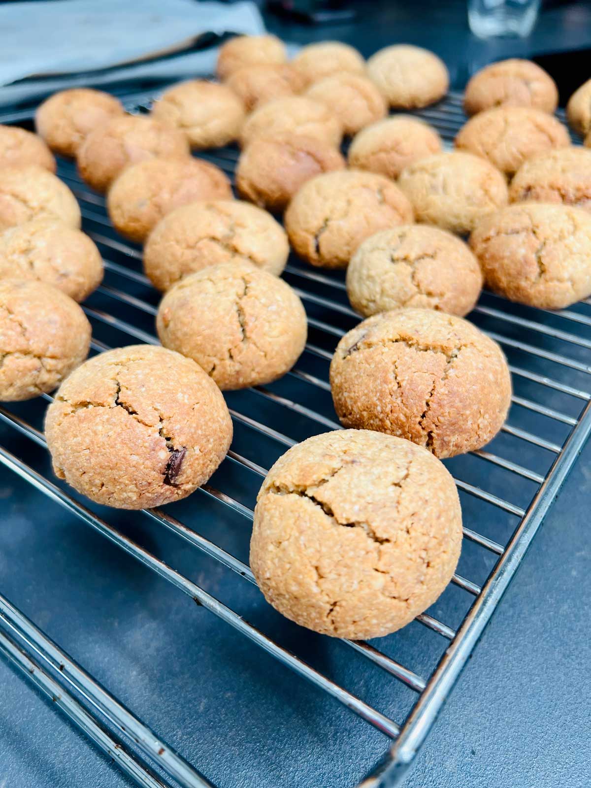 Crinkled Oat flour cookies on a cooling rack.