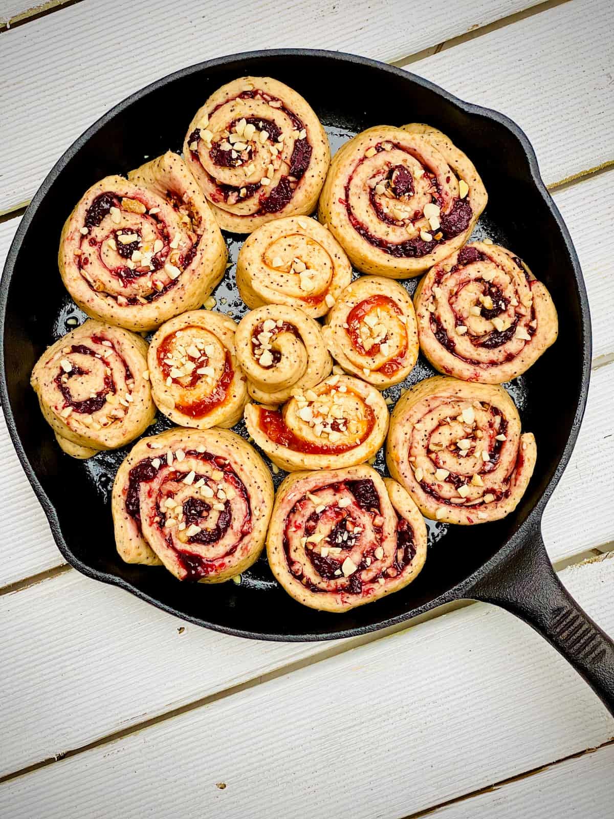 Perfect cinnamon rolls with homemade jam ready to bake