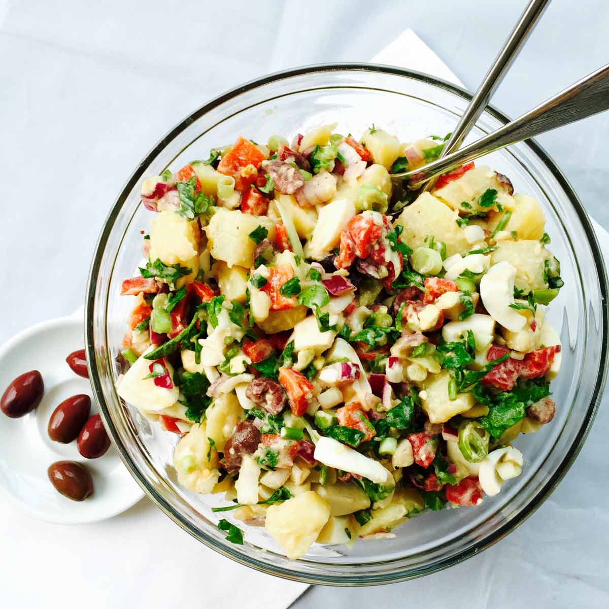 Grab a bite out of this Mediterranean potato, egg and olive salad, a yummy treat suitable for garden parties, picnics.