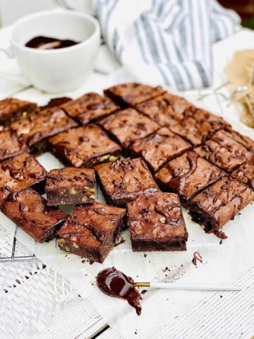 Protein brownies squares sitting on a cooling rack