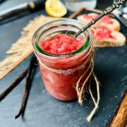 Rhubarb and gin jam in a glass jar.