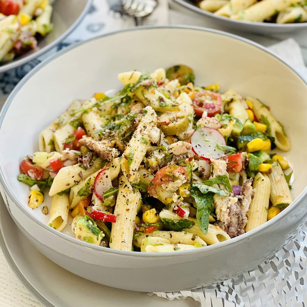 Spanish sardines pasta penne with sweet corn, radish black pepper and herbs