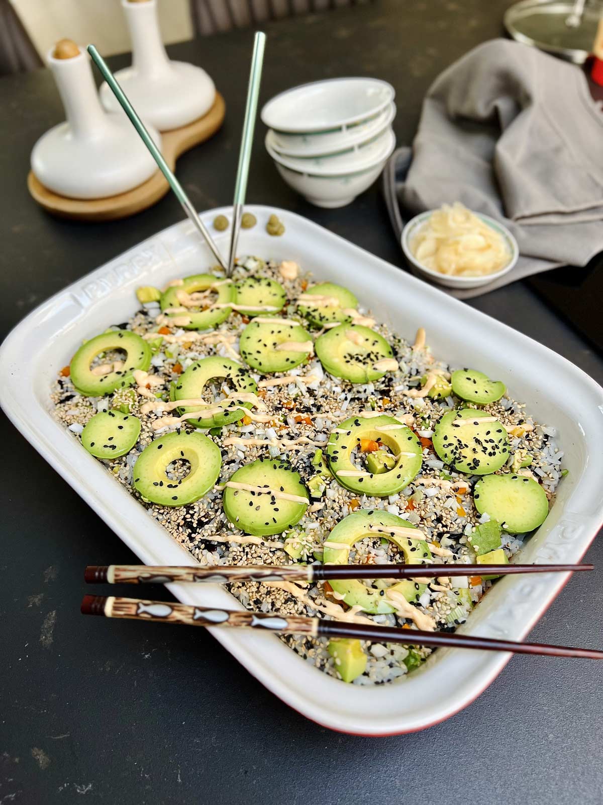 Finished off sushi, bake with sliced avocado, sprinkled with black and white sesame seeds, and I generous drizzle off sushi sauce.