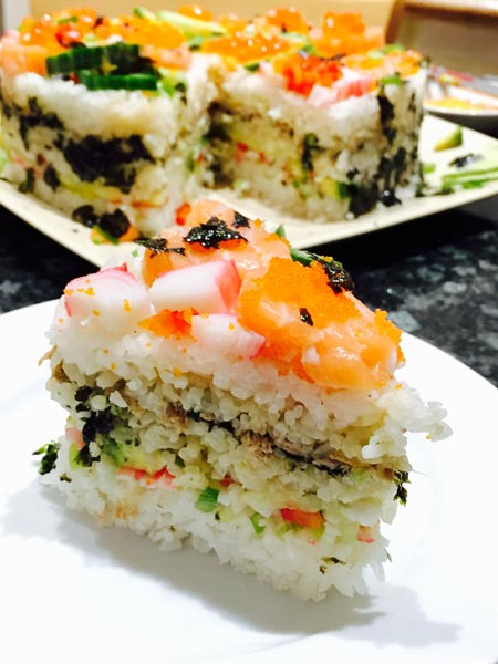 A delicious slice of homemade sushi cake.