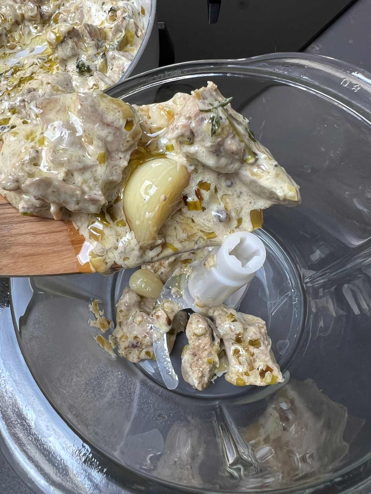 The chicken livers and the other ingredients for chicken pate being added to a blender.
